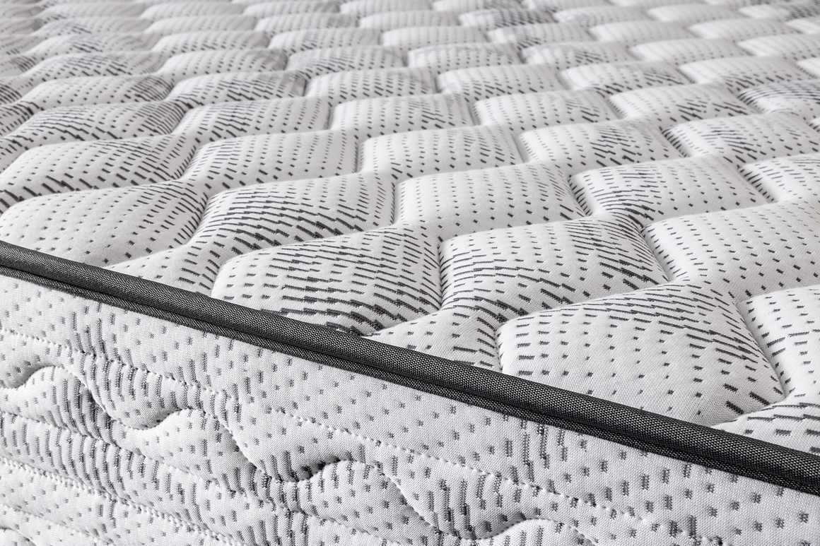 Detalle del acolchado blanco y gris del Colchón ZEUS CHESTIA